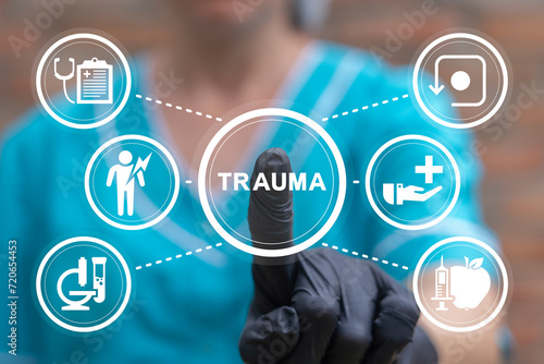 Doctor using virtual touch screen presses text: TRAUMA. Physical or mental or psychological injury trauma concept. Trauma Response. Mental health, personality type, education medical concept. photo