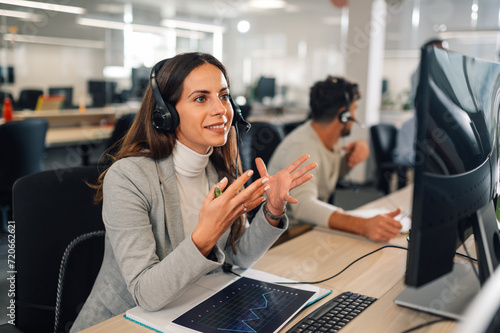 Call center female agent answering incoming calls with a headset photo