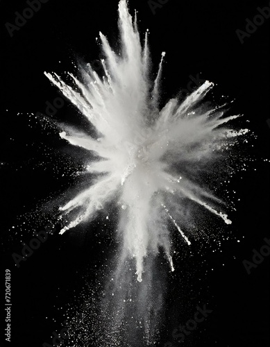 white chalk powder exploding in the air on black