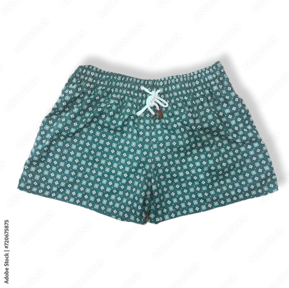 Green men's short swimming trunks with print on isolated white background Green men's short swimming trunks with print on isolated white background