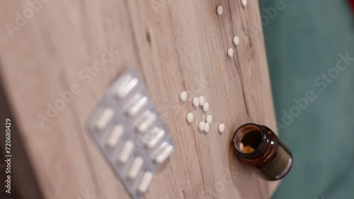 Tablets and pills. Pharmacy. Close up. Zoom out.Vertical video