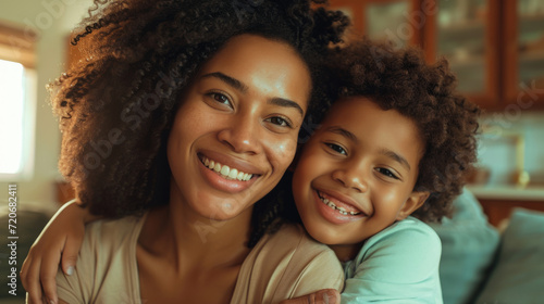 smiling woman and a young girl with curly hair