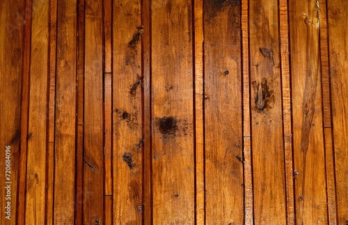 Old birch paneling painted with a brown varnish