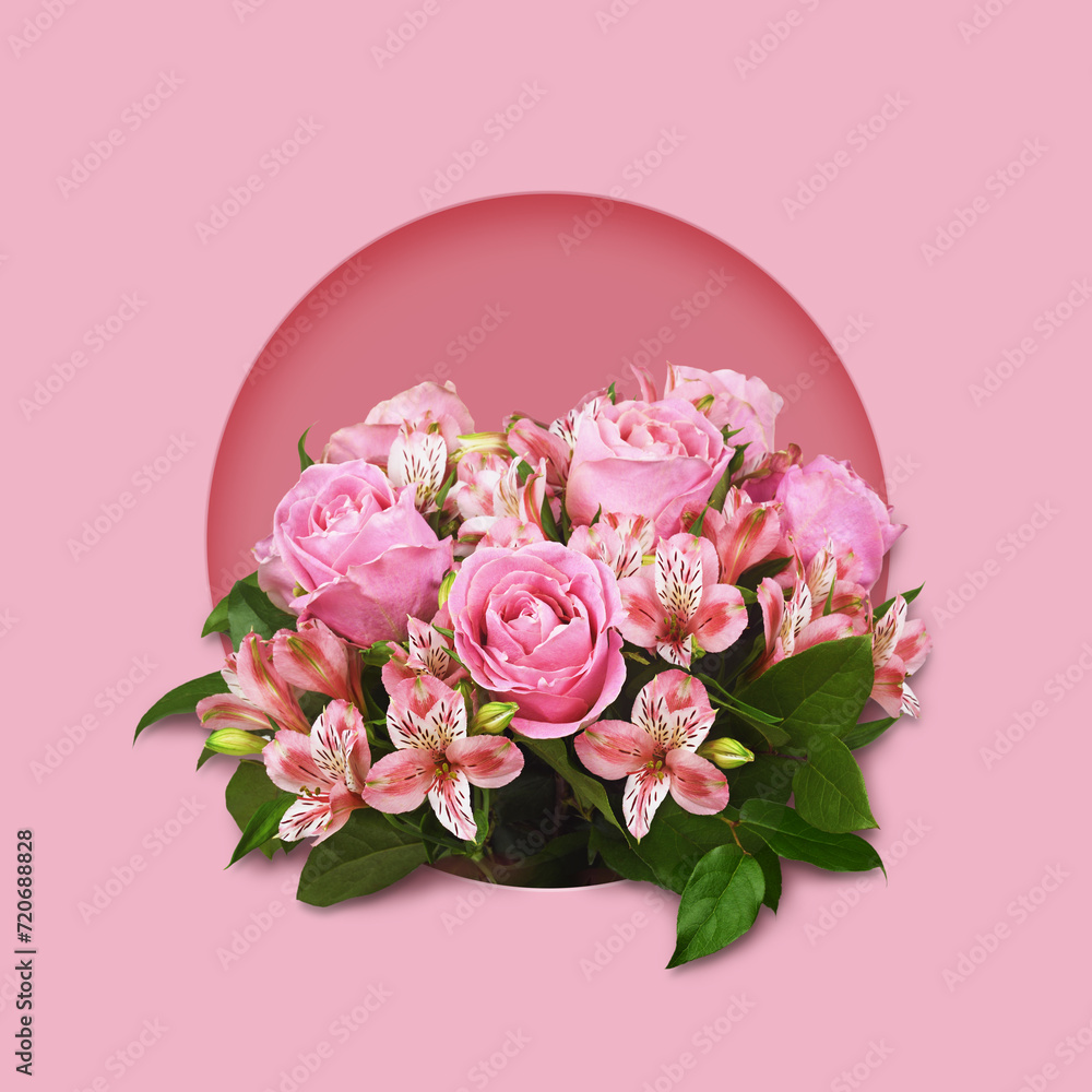 Bouquet of pink roses and alstroemeria flowers in a round frame on pink background Bouquet of pink roses and alstroemeria flowers in a round frame on pink background