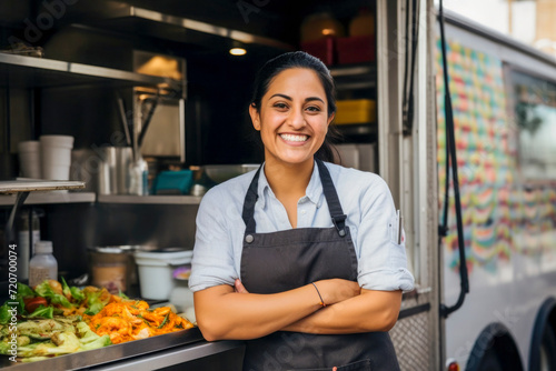 young hispanic American woman chef serving takeaway food in food truck photo