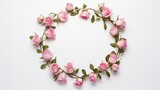 a wreath composed of pink flowers against a plain background, captured from a top view with ample copy space.