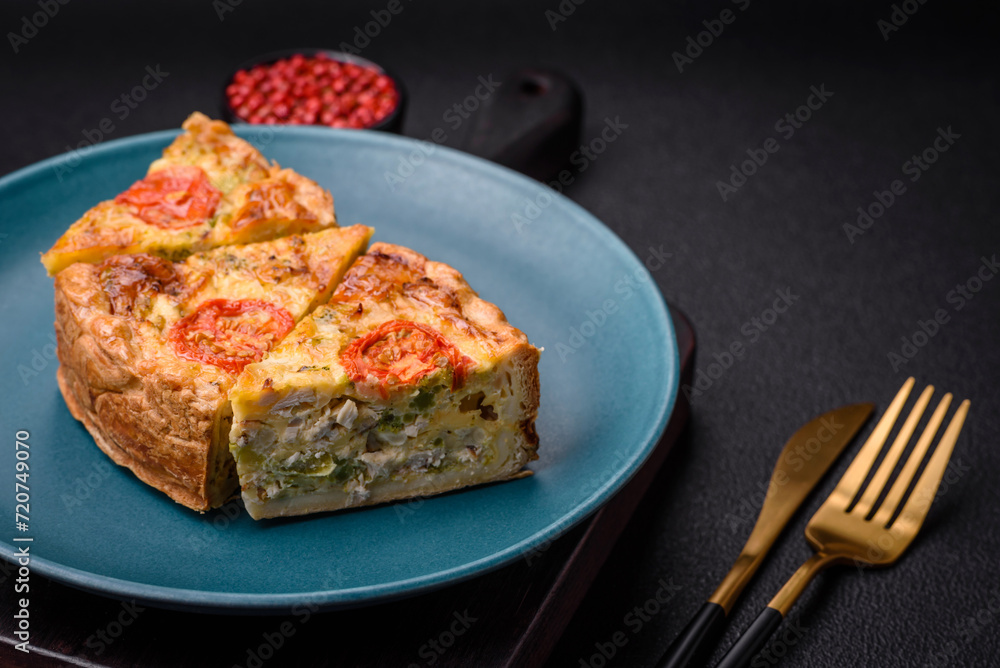 Delicious quiche with tomato, cheese, chicken, spices and herbs Delicious quiche with tomato, cheese, chicken, spices and herbs