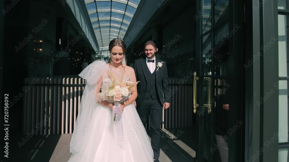 Sophisticated Wedding Duo in Atrium, Bride and groom poised in a sunlit atrium, exuding sophistication. Sophisticated Wedding Duo in Atrium, Bride and groom poised in a sunlit atrium, exuding sophistication.