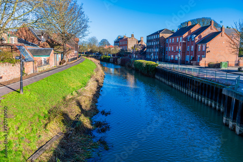 A view northward down the River Welland in Spalding, Lincolnshire on a bright sunny day photo