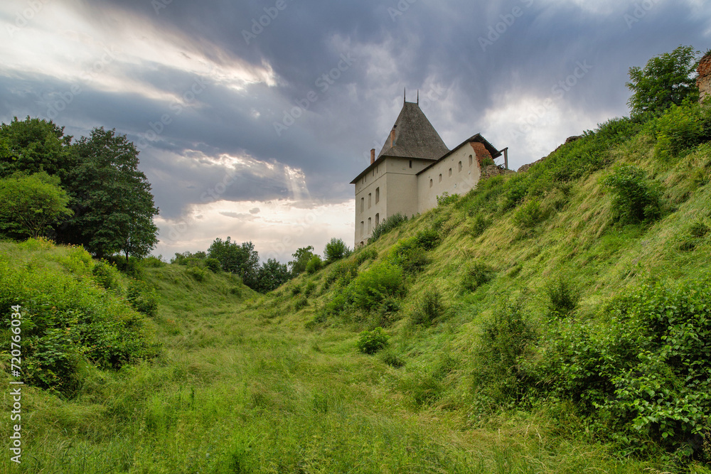 Medieval Halych Castle under stormy sky in Ukraine.