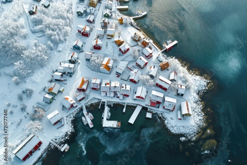 A captivating aerial view of a small town covered in a blanket of snow. Perfect for winter-themed projects or showcasing the beauty of a snowy town.