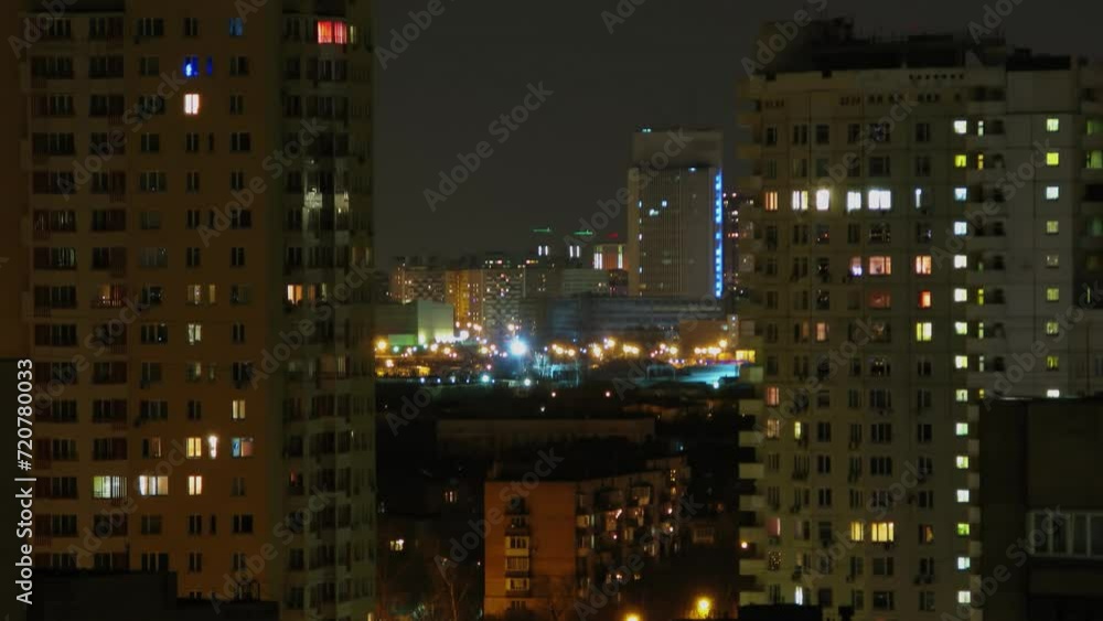 City block with illumination in windows of dwelling house at night. City block with illumination in windows of dwelling house at night.