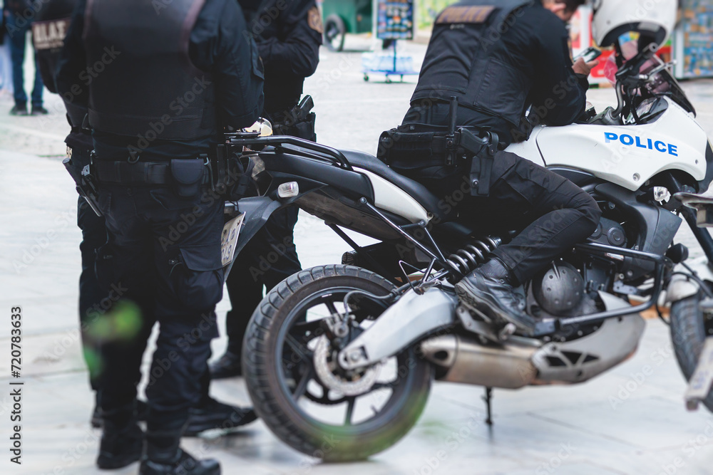 Police squad formation on duty riding bike and motorcycle, maintain public order in the european city streets, group of policemen patrol on motorbikes with Police squad formation on duty riding bike and motorcycle, maintain public order in the european city streets, group of policemen patrol on motorbikes with