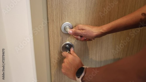 Woman locking the door