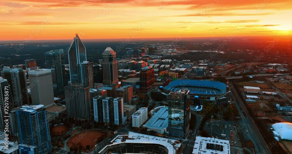 Amazing sunset in the American metropolis. Scenic view of Charlotte, NC, USA with stunning orange sky above. Top view. Amazing sunset in the American metropolis. Scenic view of Charlotte, NC, USA with stunning orange sky above. Top view.