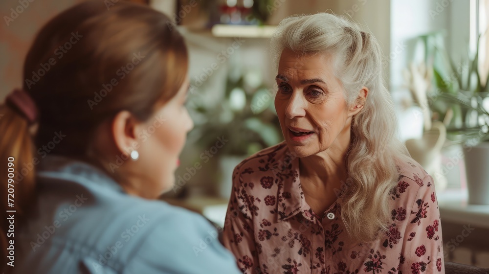 Health visitor and a senior woman during home visit. Health visitor and a senior woman during home visit.