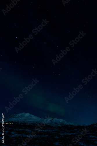 Northern lights night in Tromso in Norway ona cold night in winter  © SandraSevJarocka