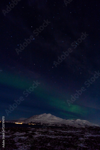 Northern lights night in Tromso in Norway ona cold night in winter  © SandraSevJarocka
