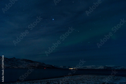 Northern lights night in Tromso in Norway ona cold night in winter 