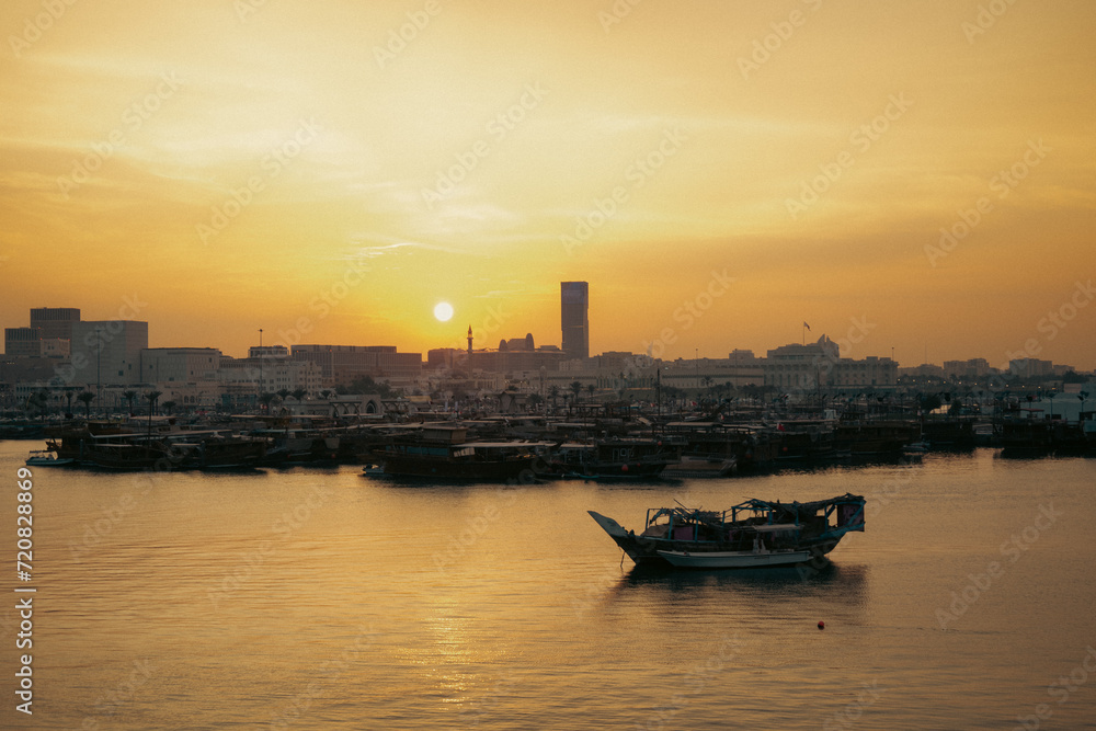 Doha,Qatar-December 28,2022 : Doha buildings in Qatar and the sun at sunset