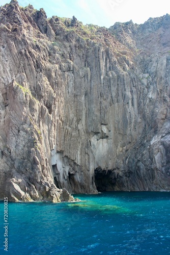 turquoise lagoon close to sicily and stone cliff