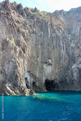 turquoise lagoon close to sicily and stone cliff