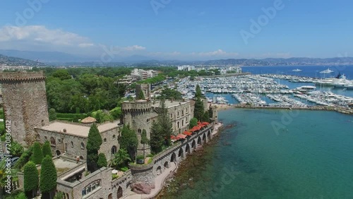 Castle of Napoule near Chateau beach with people and many vessel photo