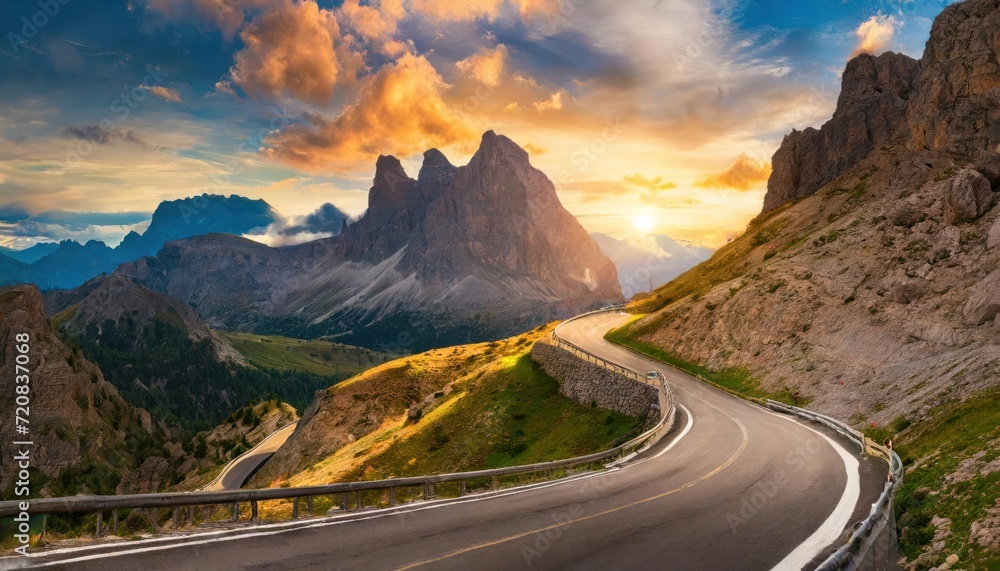 Beautiful curved roadway, rocks, stones, blue sky with clouds. Landscape with empty highway