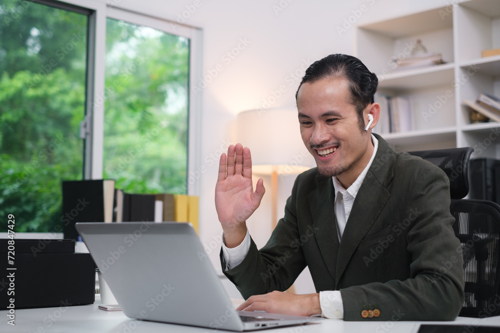 Smart asian businessman smile using video conference Meeting online via laptop, remote working discuss in conversation about strategy planing for new business marketing startup ideas concept. Smart asian businessman smile using video conference Meeting online via laptop, remote working discuss in conversation about strategy planing for new business marketing startup ideas concept.