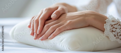 Closeup of Female Hand on Orthopedic Pillow - A Closeup Look at the Benefits of an Orthopedic Pillow for a Relieved Female Hand