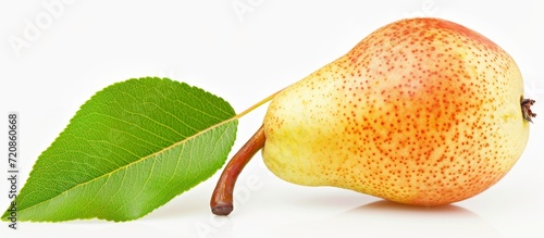 Half of a Ripe Pear with an Isolated Leaf: A Perfectly Half, Ripe Pear with Vibrant Leaf, Isolated for Freshness photo