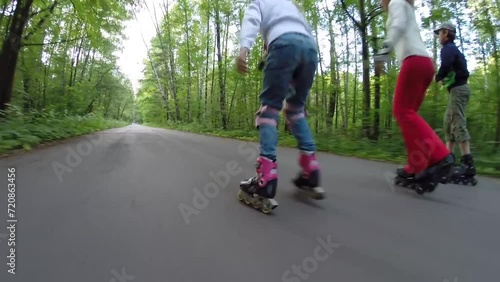 Wallpaper Mural Woman and two children roller skate in green summer park Torontodigital.ca