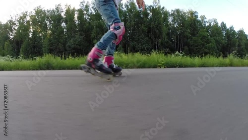 Wallpaper Mural Happy girl in pink rollerblades roller skates on road at summer Torontodigital.ca