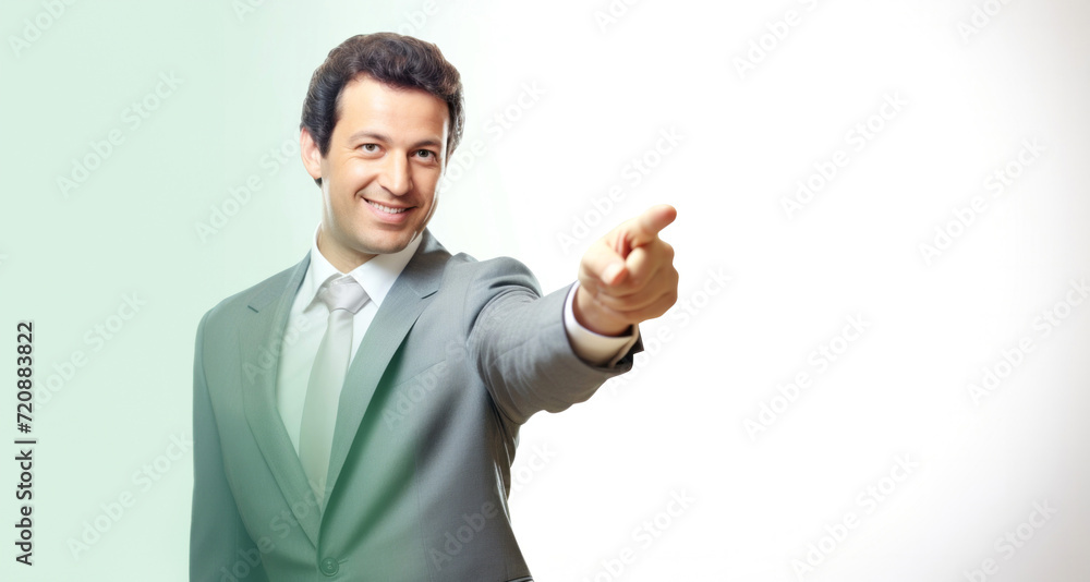 Businessman pointing at the camera, isolated on a white background. Businessman pointing at the camera, isolated on a white background.