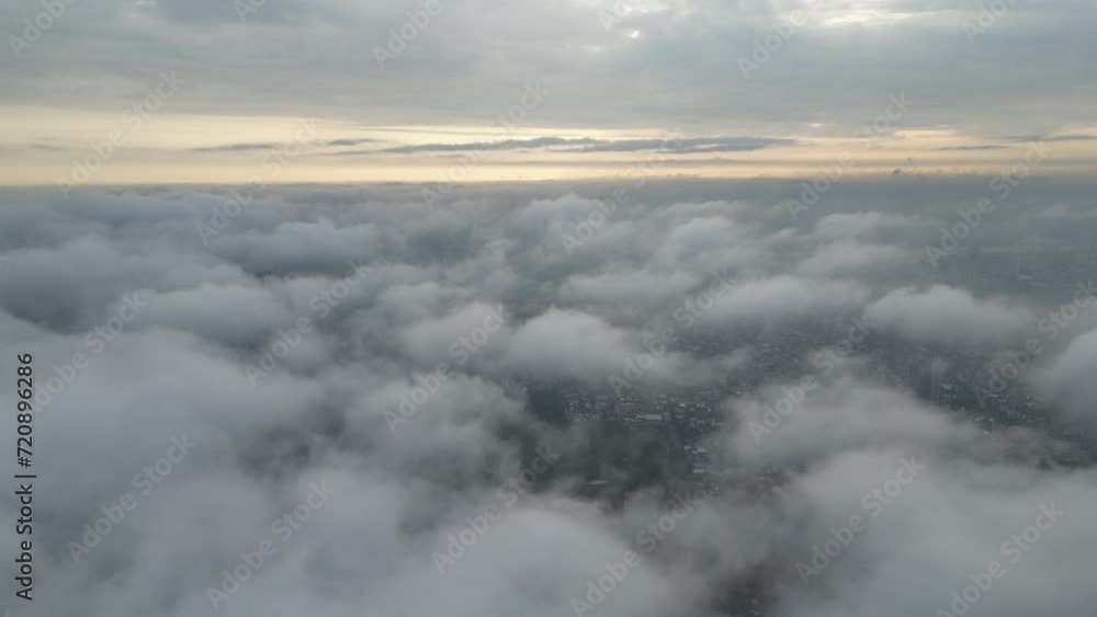 4K Aerial view front of airplane flying through the white fluffy clouds 4K Aerial view front of airplane flying through the white fluffy clouds