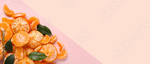 Sweet peeled tangerines on pink background with space for text, top view
