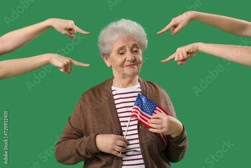 People pointing at senior w...