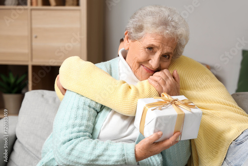 Young woman hugging her gra...