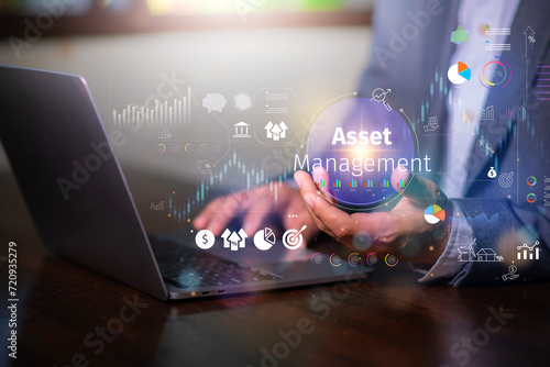 Asset management concept, Businessman Holding asset management and Icon  on virtual display. Financial Property Digital assets. photo