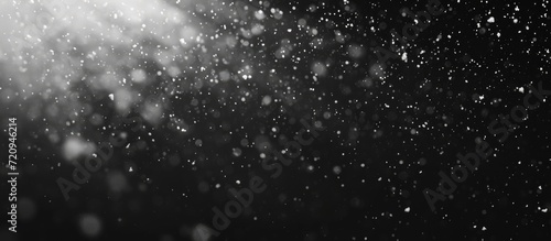 Overlay abstract black texture with falling snowflakes onto any object against a real snow background.