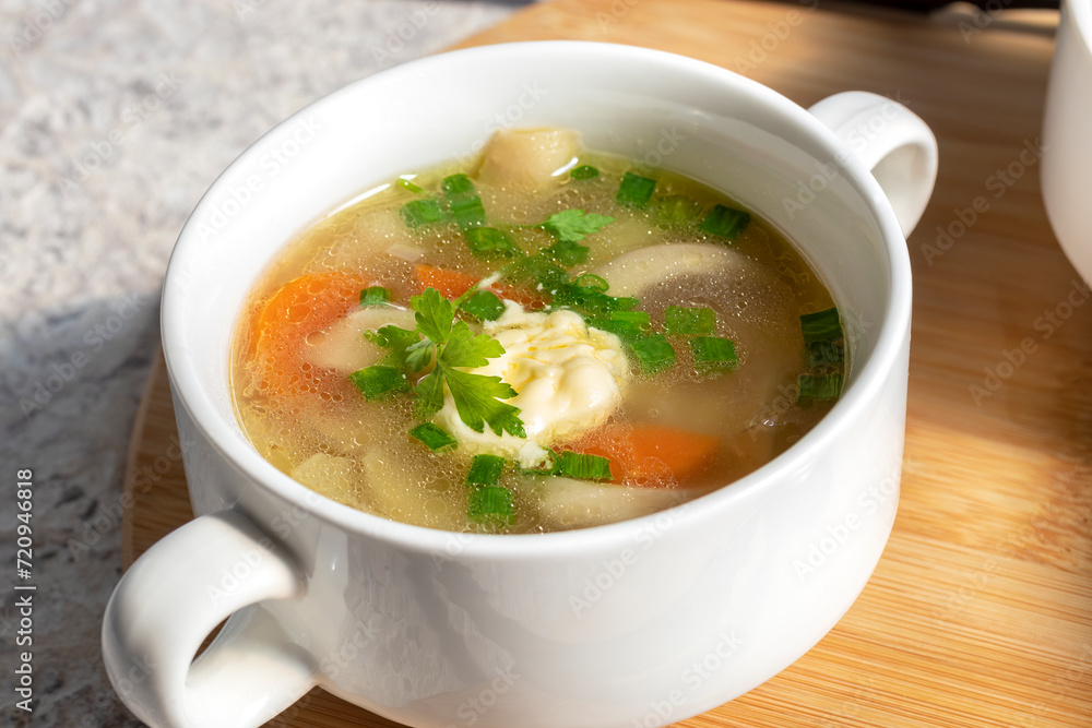 Soup in soup bowl. Portion of fresh soup in serving tureen Soup in soup bowl. Portion of fresh soup in serving tureen