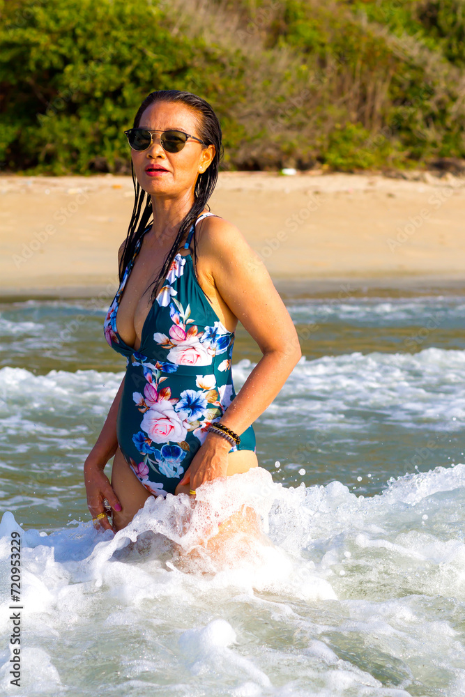 Fototapeta premium Woman body pretty with swimsuit relax at beach