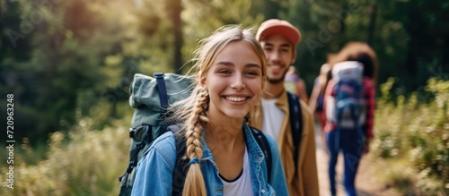 Happy teenagers hiking together.