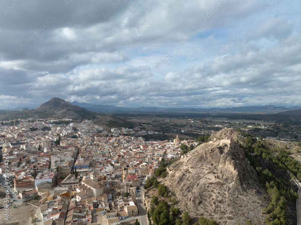 Aerial view of Medieval Castle of San Juan and the town of Calasparra in Murcia Spain with old quarter wrapped around the foot of the hill