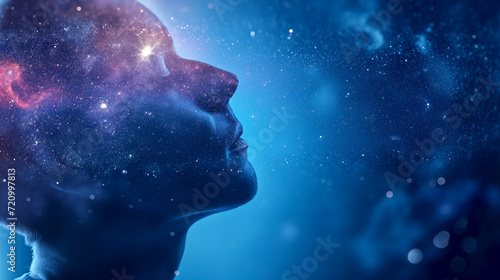 A man meditates against the background of the starry sky.