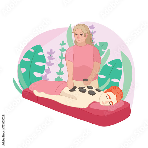 Woman receiving hot massage with stones in spa salon