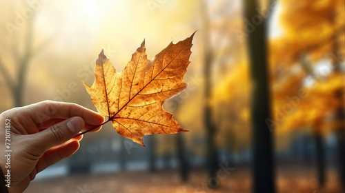 Closeup of Hand Holding Bright Leaf Against Autumn Trees AI Generated