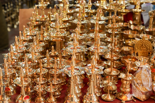 Indian traditional samai or samayee diya brass lamp. Hindu puja stuff or puja thali many lamp near temple for yoga worship 