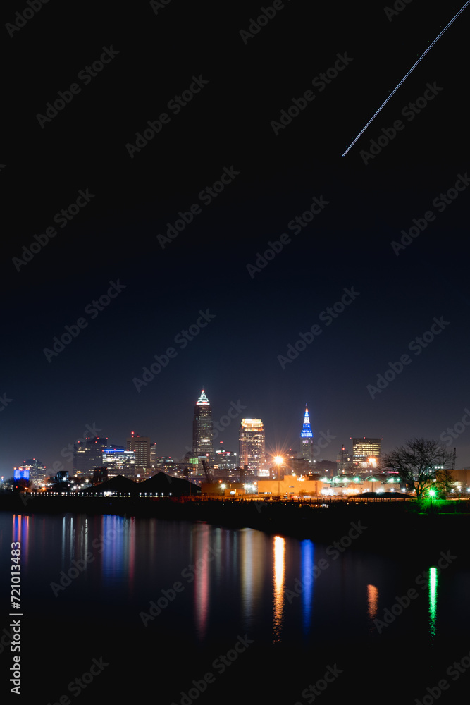 City of Cleveland at Night with Airplane Light Trail Portrait Shot