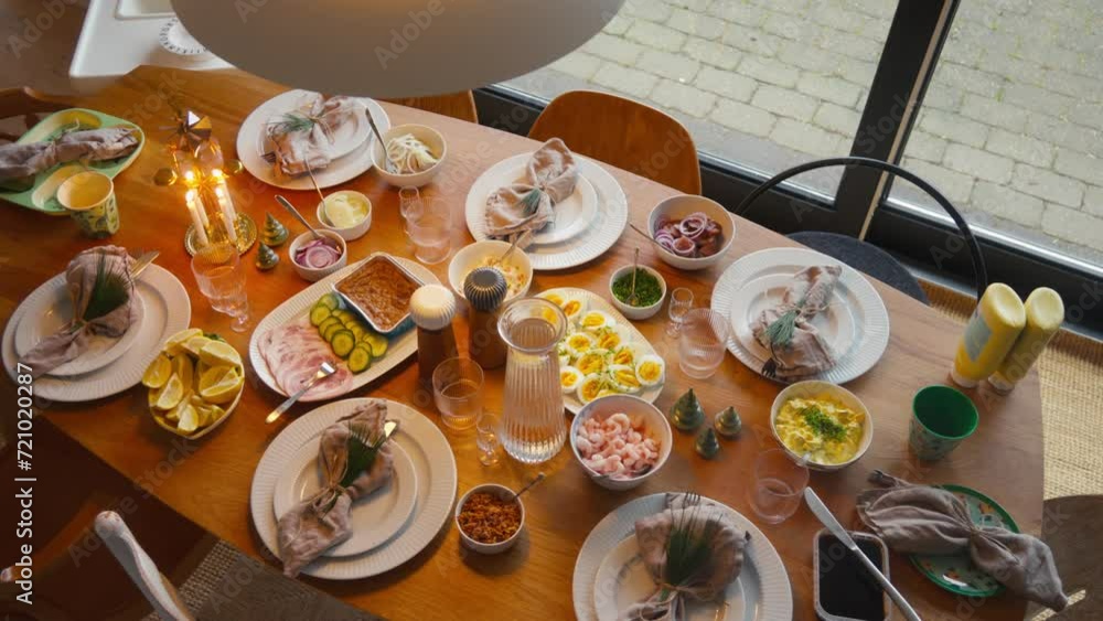 Elegantly set table with a spread of Scandinavian dishes, ready for a feast. Elegantly set table with a spread of Scandinavian dishes, ready for a feast.
